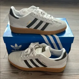 Adidas Men’s White and Black Sneakers