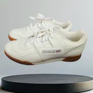 Classic REEBOK Men's Sneaker, Size 10, White With Rubber Sole.