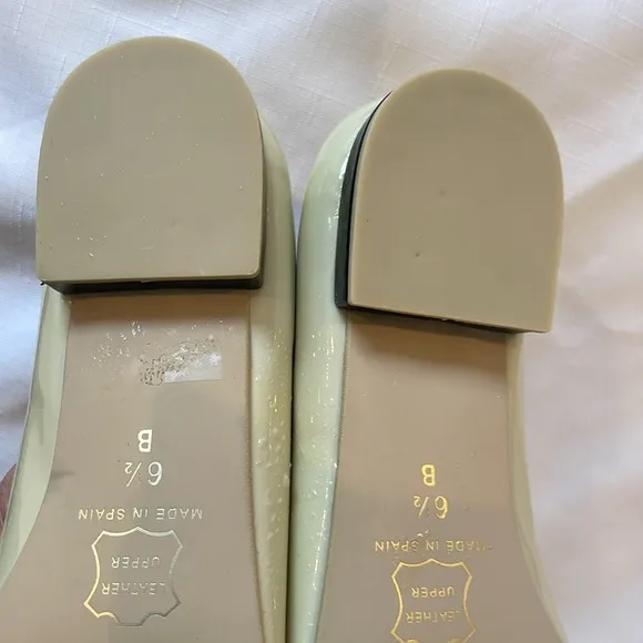 FRENCH SOLE BRAIDED FRONT DESIGN, FLATS ARE CREAM AND BLACK.   NEW IN BOX