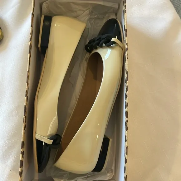 FRENCH SOLE BRAIDED FRONT DESIGN, FLATS ARE CREAM AND BLACK.   NEW IN BOX