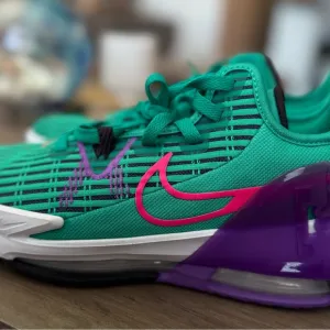 Green and Purple Athletic Shoes with Pink Accents