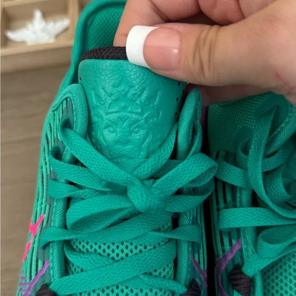 Green and Purple Athletic Shoes with Pink Accents