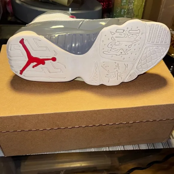 Jordan White and Gray Athletic Shoes with Red Accents