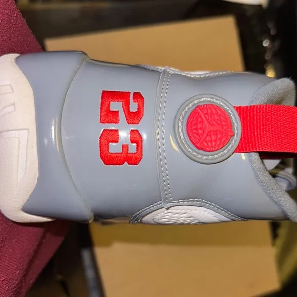 Jordan White and Gray Athletic Shoes with Red Accents