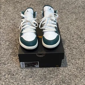 Jordan White and Green Sneakers with Classic Design and Leather Upper