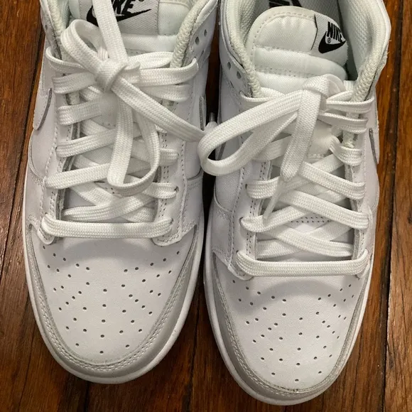 Ladies nike dunk low triple white monochromatic leather construction sneakers