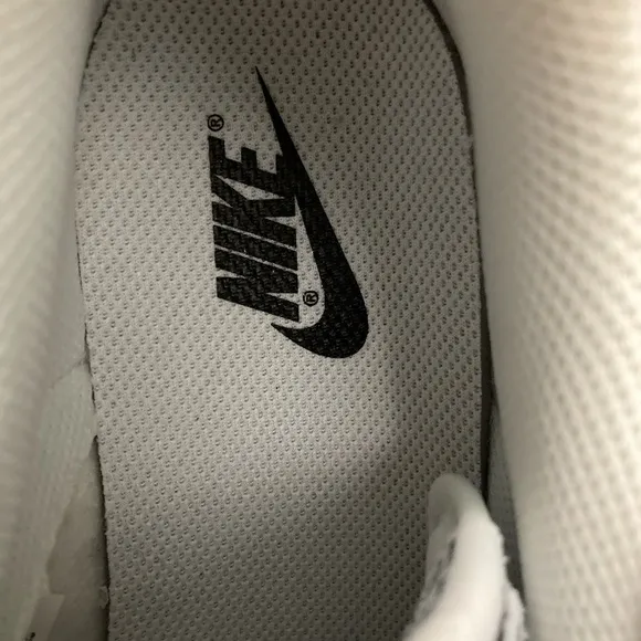 Ladies nike dunk low triple white monochromatic leather construction sneakers