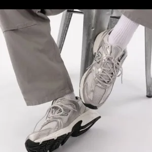 New Balance Silver and Black Athletic Shoes