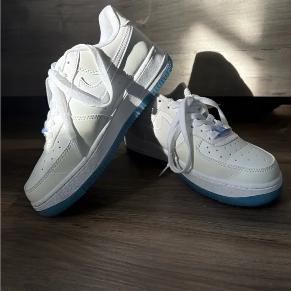 Nike White and Blue Athletic Shoes with Classic Design