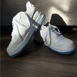 Nike White and Blue Athletic Shoes with Classic Design