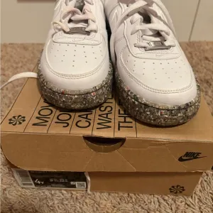 Nike White Sneakers with Speckled Sole