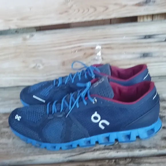 On Running Blue and Red Athletic Shoes with CloudTec Sole