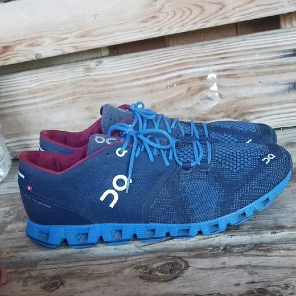 On Running Blue and Red Athletic Shoes with CloudTec Sole