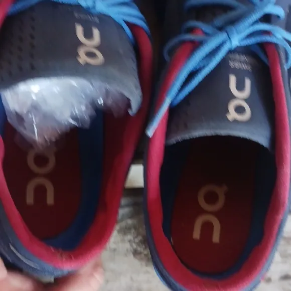 On Running Blue and Red Athletic Shoes with CloudTec Sole