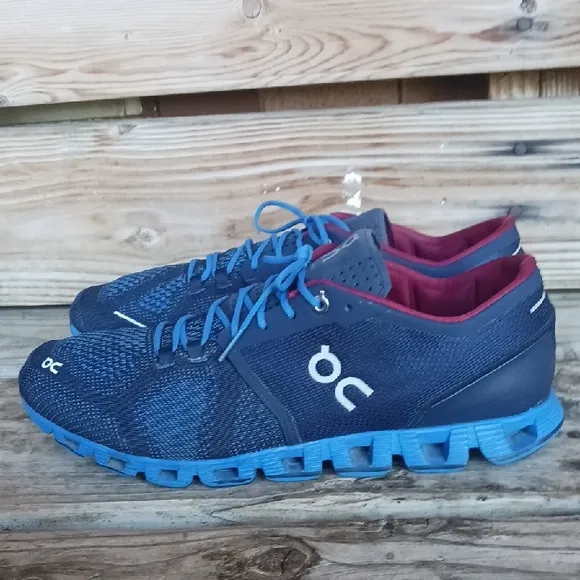 On Running Blue and Red Athletic Shoes with CloudTec Sole