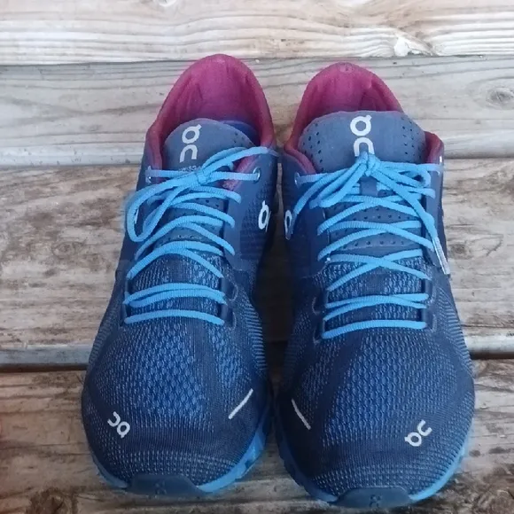 On Running Blue and Red Athletic Shoes with CloudTec Sole