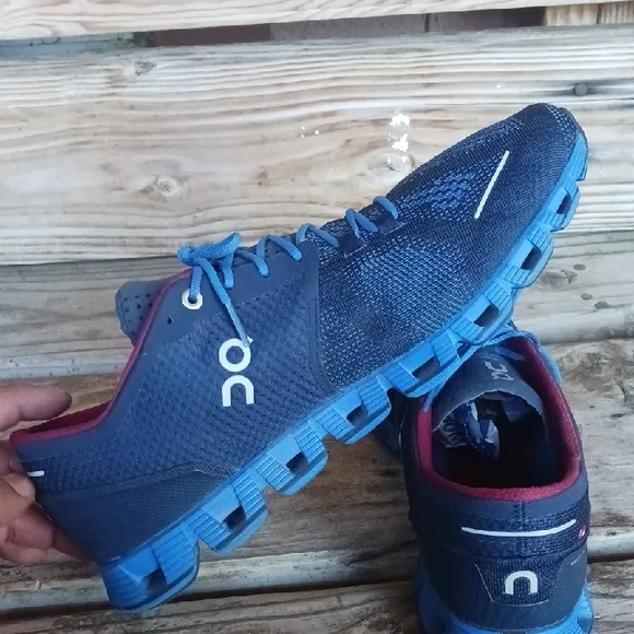 On Running Blue and Red Athletic Shoes with CloudTec Sole