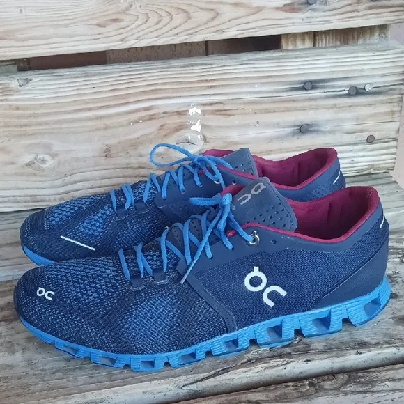 On Running Blue and Red Athletic Shoes with CloudTec Sole