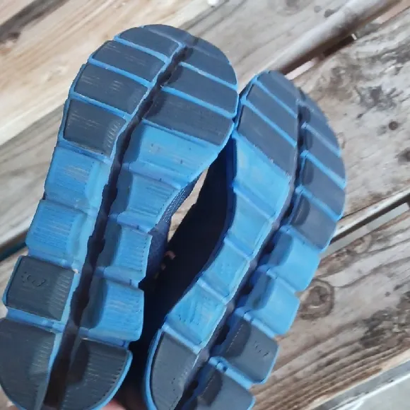 On Running Blue and Red Athletic Shoes with CloudTec Sole