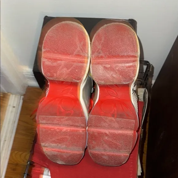 Red Sole Sneakers with Bold Design