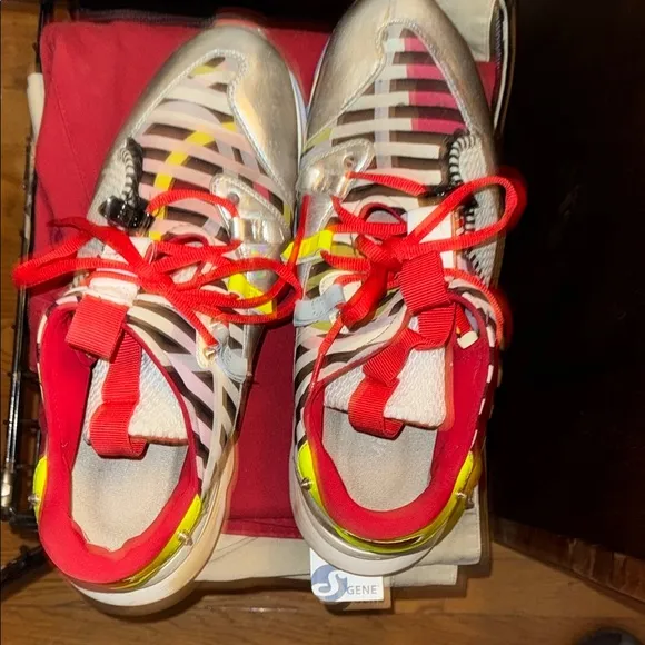 Red Sole Sneakers with Bold Design